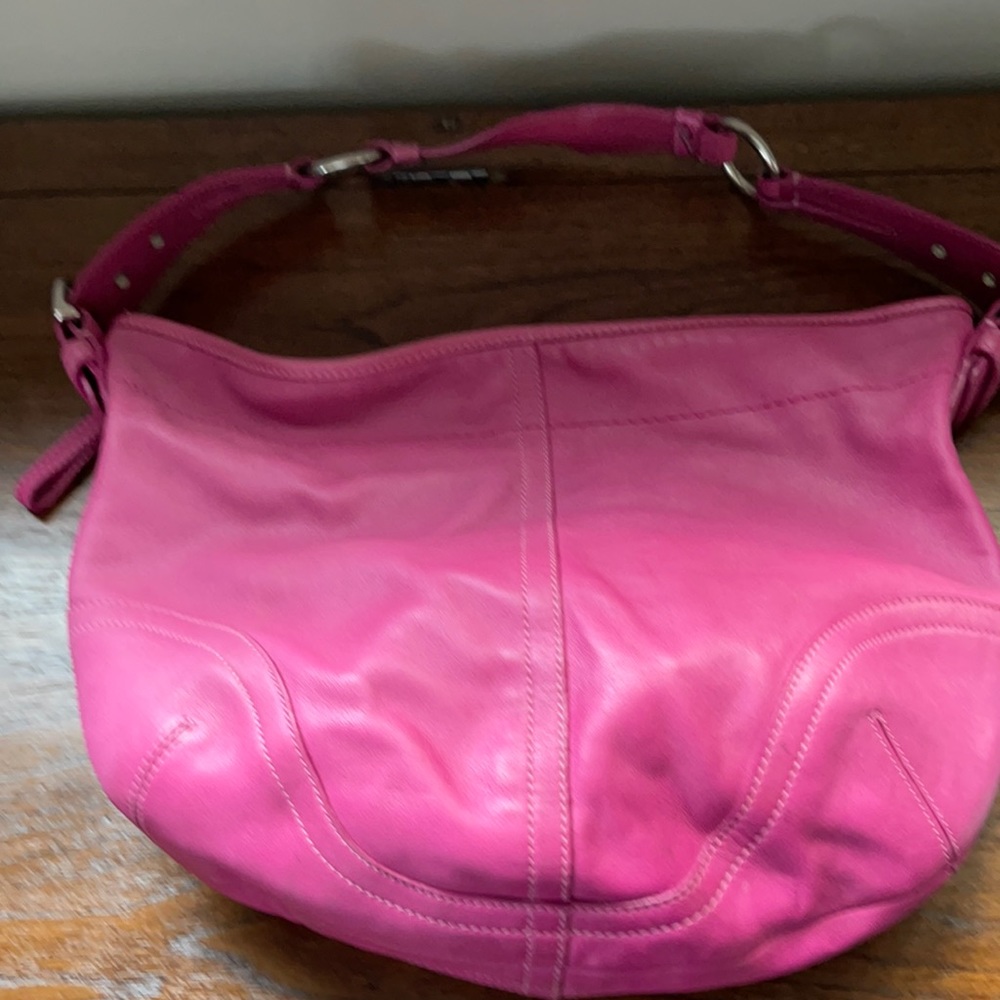 Hot pink Coach bag, has received some love